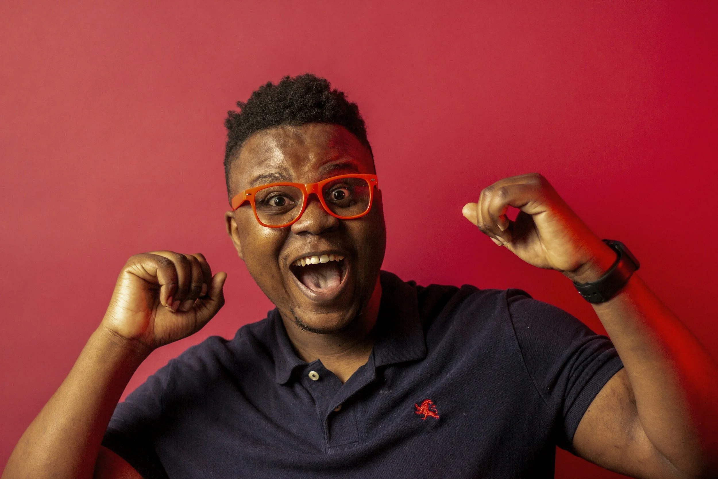 Happy black guy with red glasses