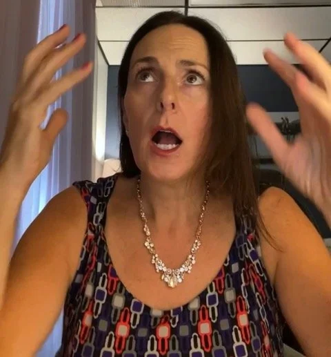 Alyse, business coach for therapists, raising her hands in frustration to illustrate the insurance panel nightmare that private practice coaching can help therapists escape to make more money