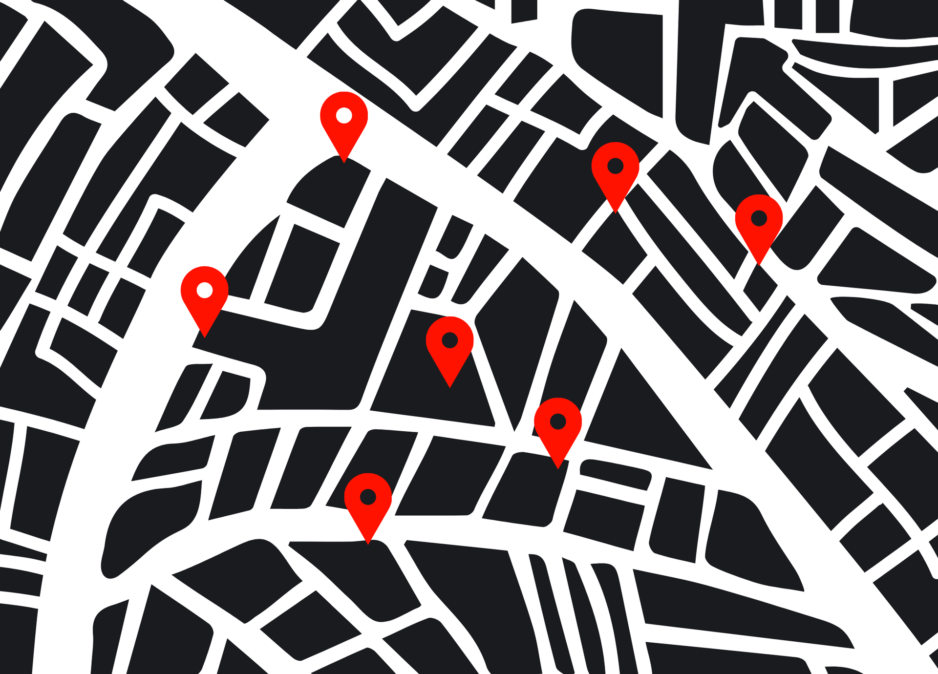 Map with black buildings, white streets, and six red location markers.