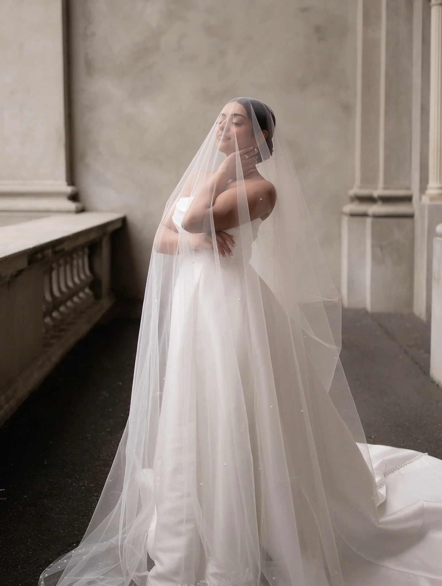 When Kaveesha enlisted me to create a custom veil scattered with ivory pearls, I knew it would be a labour of love. 
I spent countless hours placing pearls in three sizes, tracing the edges and scattering them through the centre so they shimmer softl
