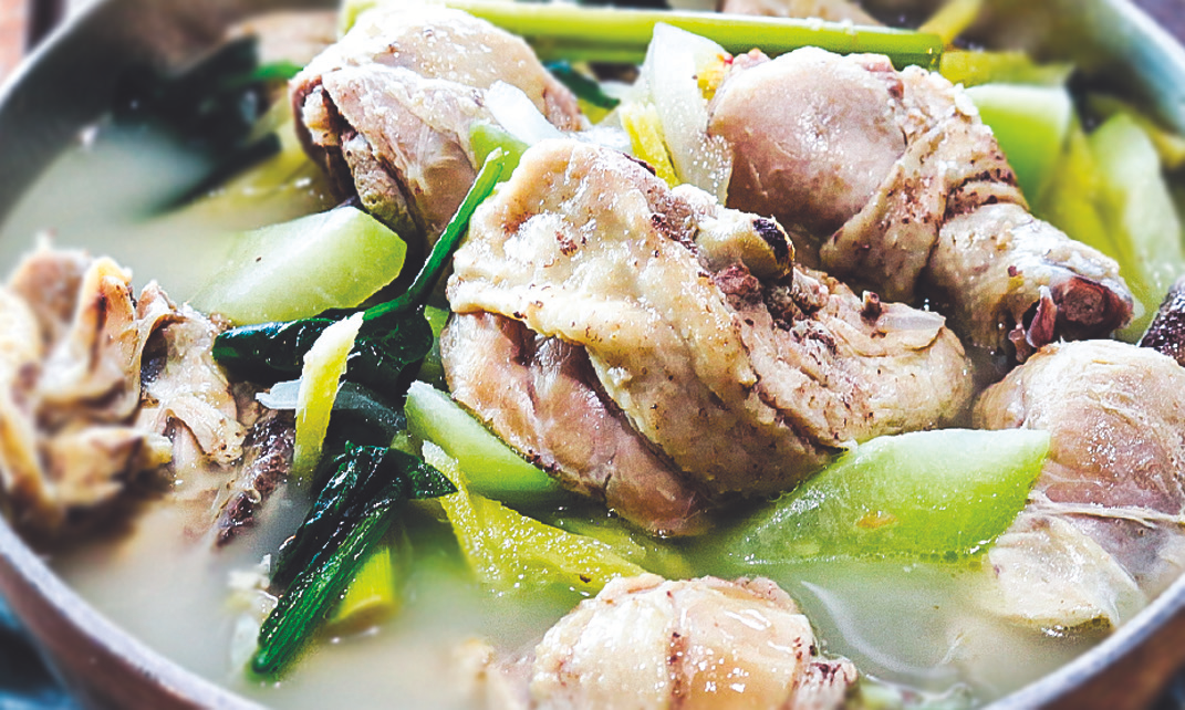 Chicken in garlic, ginger, lemongrass broth with chayote, pepper leaves, and spinach.