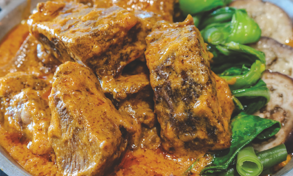 Tender beef brisket in savory peanut sauce with assorted vegetables.