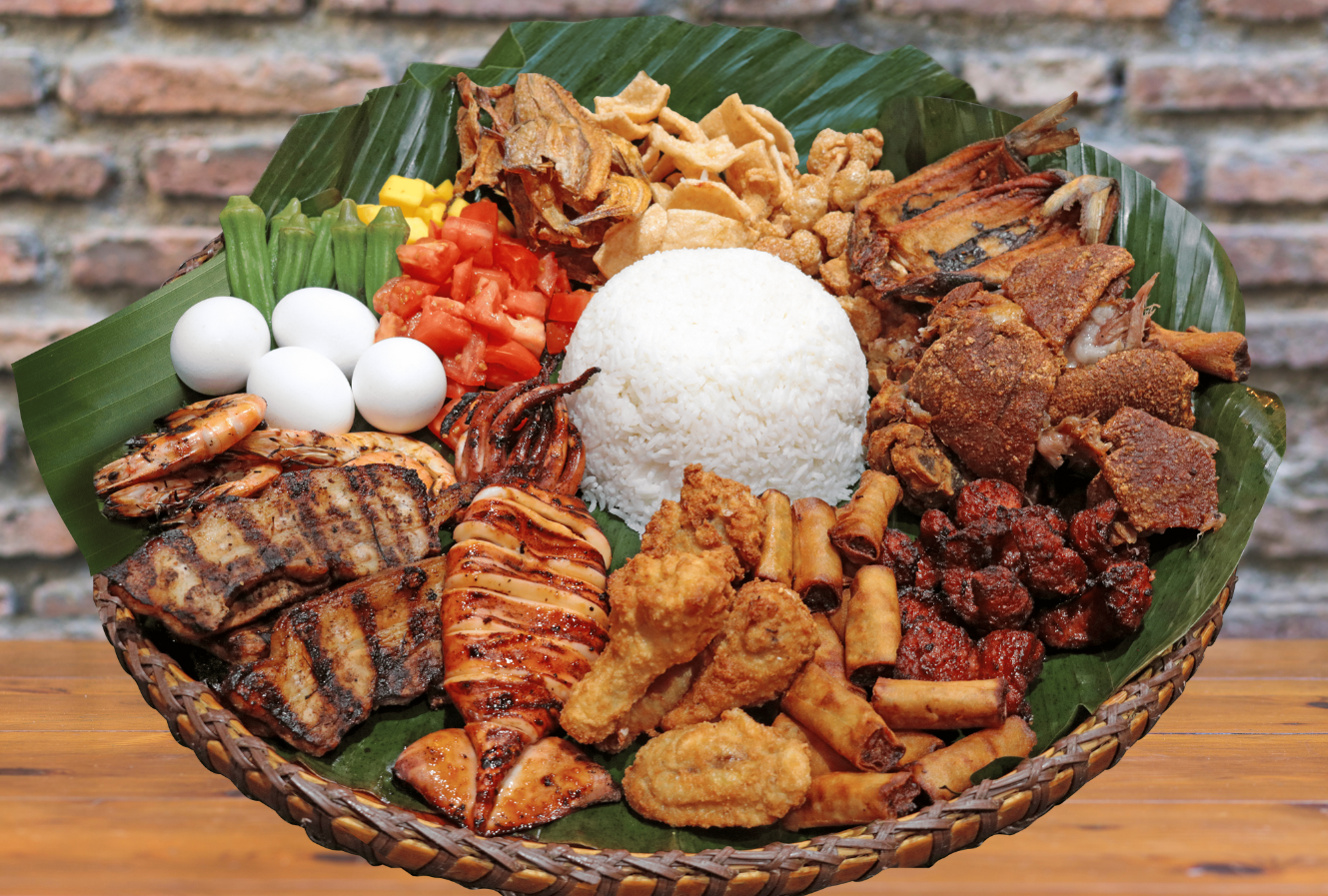 Picture of Sulit Bilao 4 with crispy pata, grilled liempo, jumbo squid, and other Filipino dishes.