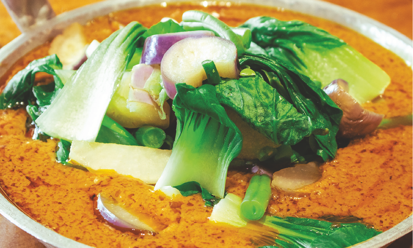 Bok choy, green beans, and eggplant in a creamy peanut-based sauce.