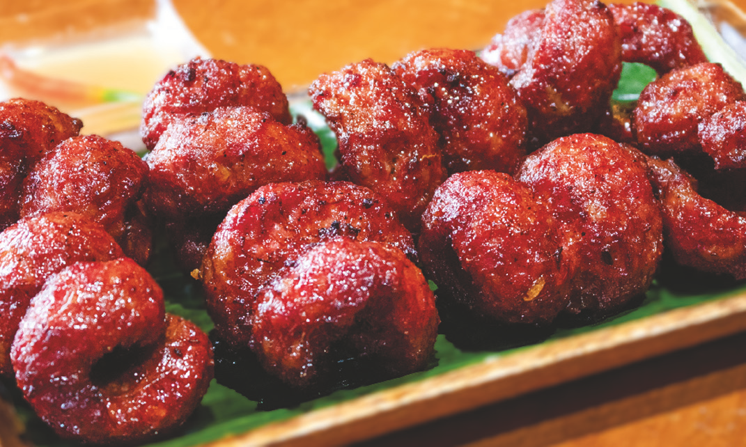 Sweet Filipino pork sausages arranged on a plate