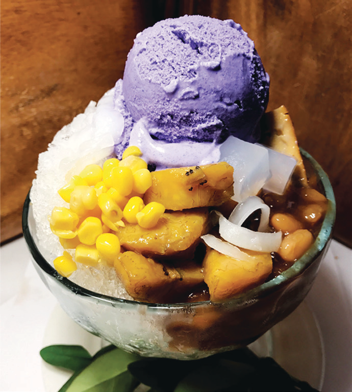 Mixed sweet beans, fruits, and shaved ice topped with ube ice cream and flan