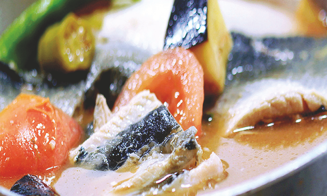 Boneless milkfish in garlic, ginger, tamarind sour broth with assorted vegetables