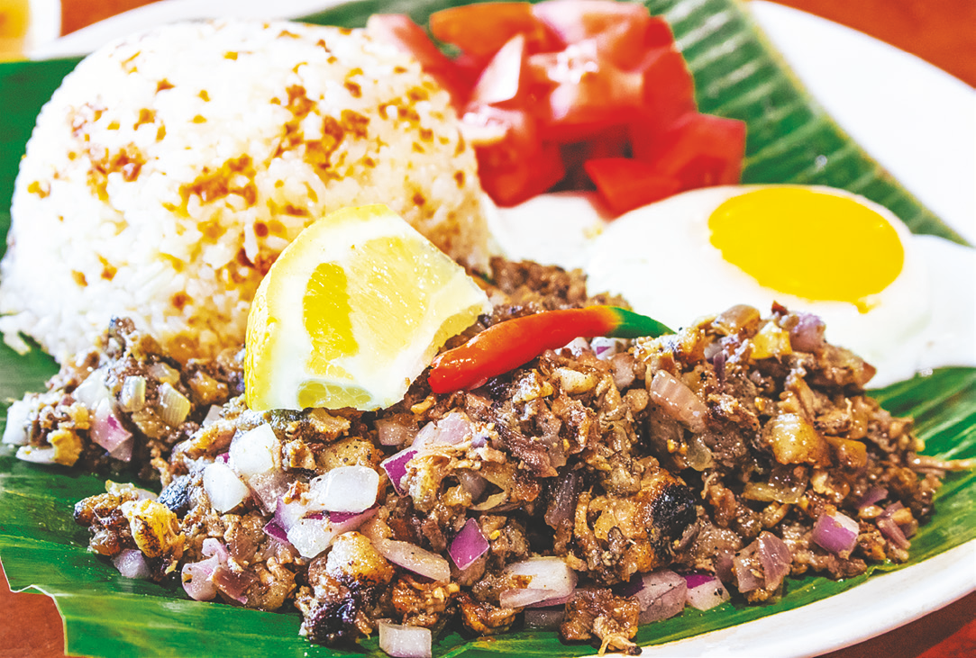 Spicy grilled minced pork sautéed with spices, served with rice, fried egg, and tomato