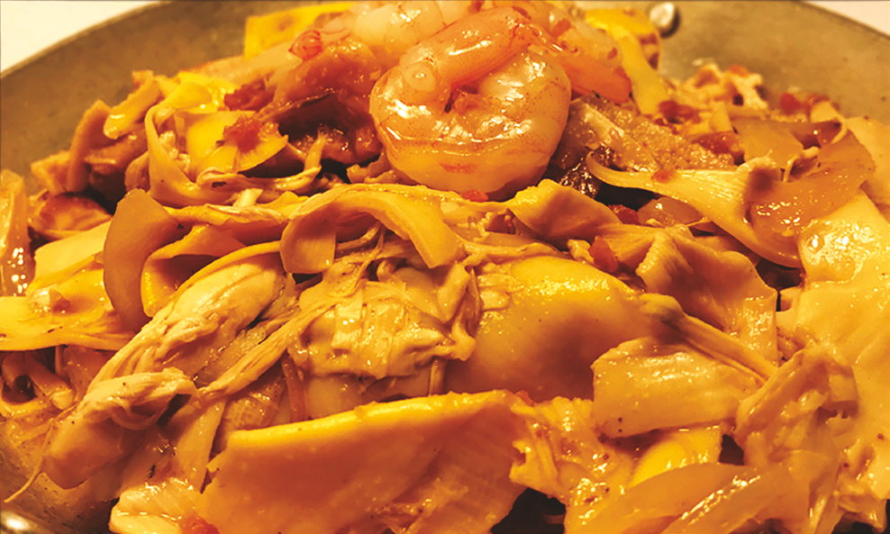 Banana blossom cooked with pork and shrimp in a light adobo sauce with garlic and vinegar.