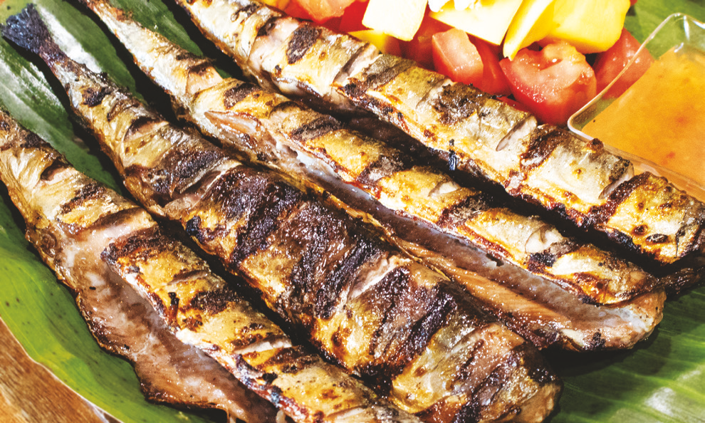Smoked mackerel served with Ensaladang Kapampangan (diced mango and tomato)