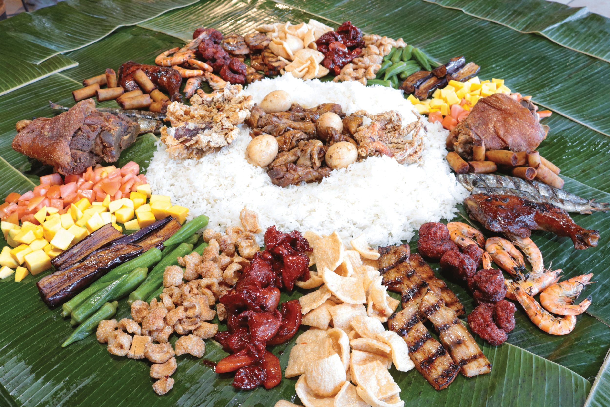 Picture of Sulit Bilao 4 with crispy pata, grilled liempo, jumbo squid, and other Filipino dishes
