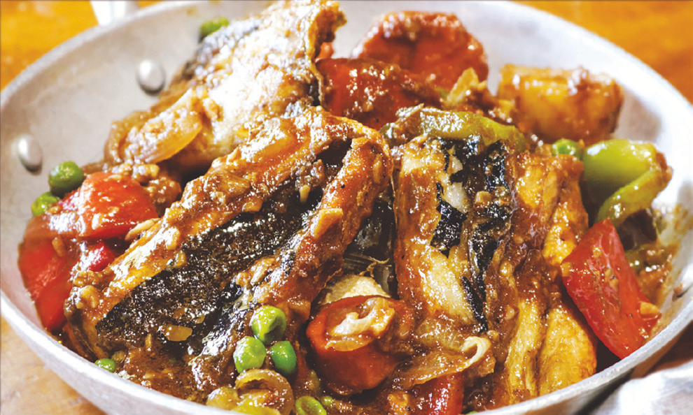Boneless milkfish stewed with carrots, green peas, potatoes, and bell peppers.
