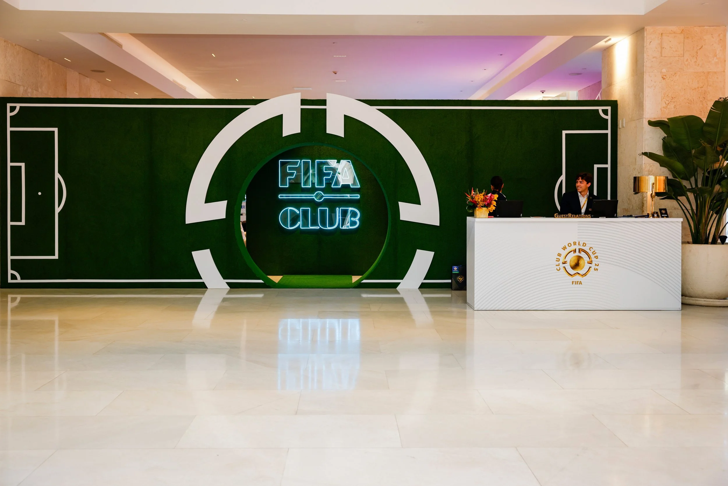Fabricated turf wall with dimensional pitch line work and detailing and branded welcome desk greeted guests into the exclusive club space. (Grand Beach Hotel; Miami, FL)