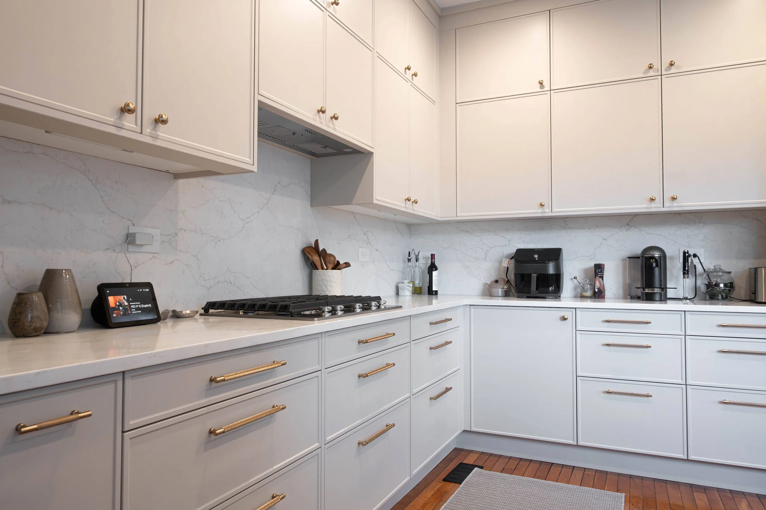 A detailed look at custom joinery and professional-grade appliances, accented by the brushed gold hardware that is currently trending in Chicago luxury homes.