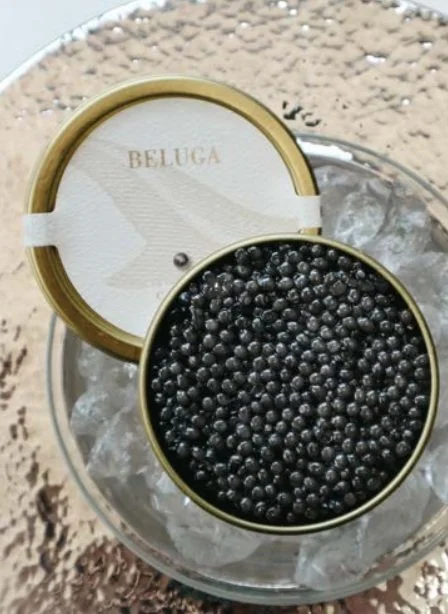 Close up of Black Pearl caviar tin on ice