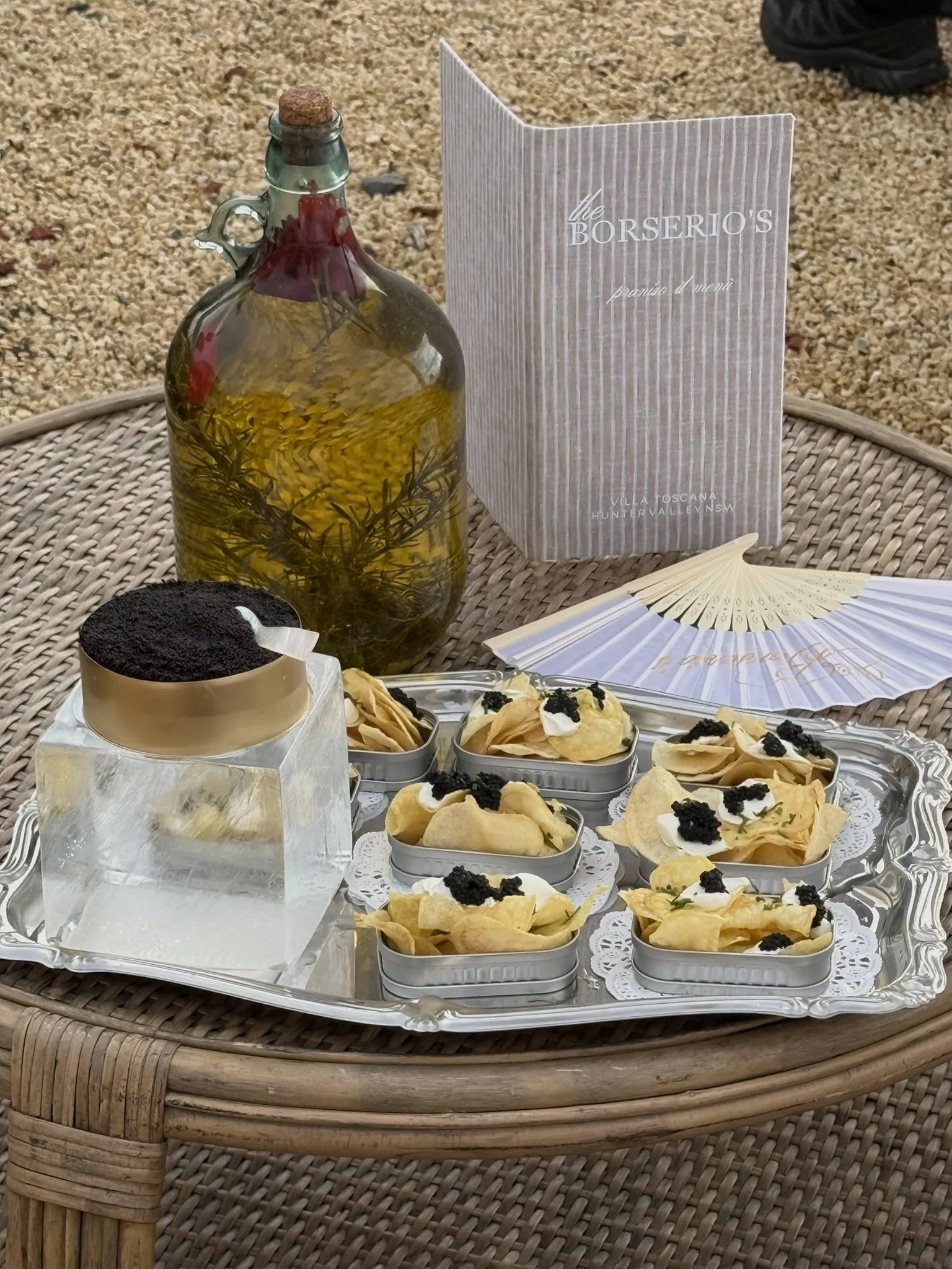 Premium caviar on large block of ice, chips and caviar in individual sardine tins. Bespoke styling for Hunter Valley Wedding. 