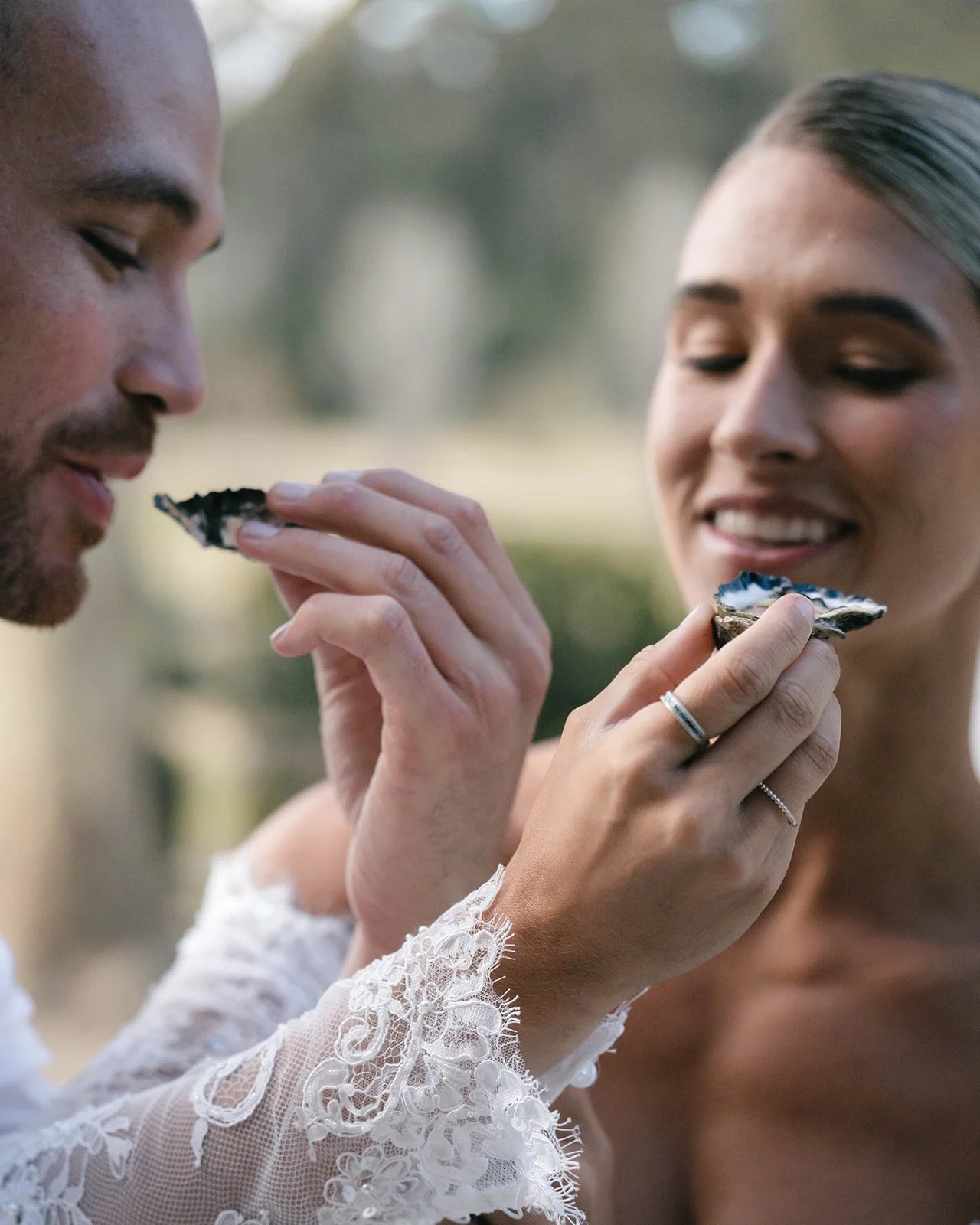 Wedding couple enjoying freshly shucked sydney rock oysters at wedding in Wollombi NSW