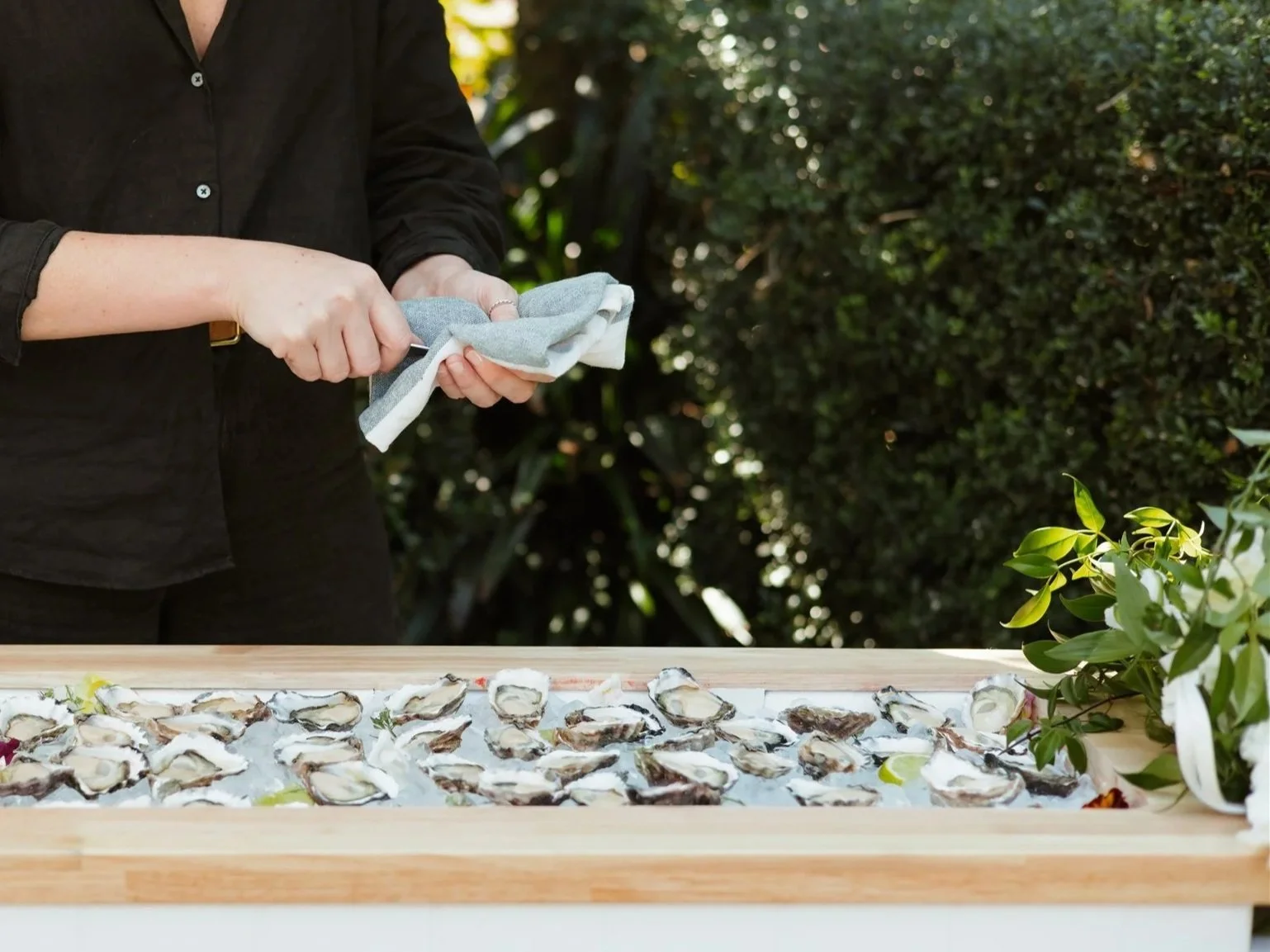 Live oyster shucking at a private backyard event in Newcastle. Shuck Yeah Oyster Catering