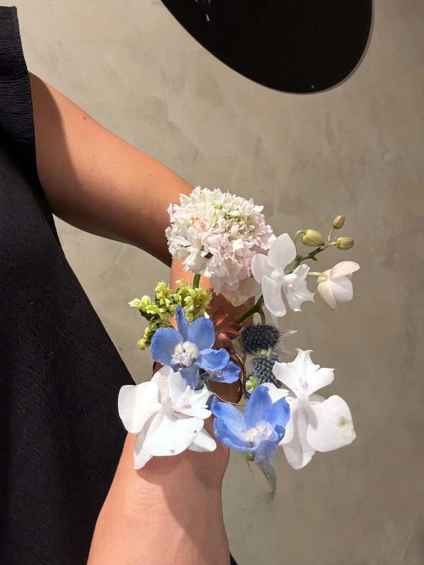 This corsage breaks the mold. Handcrafted with wire, minimal adhesive, and long-lasting elegant flowers makes a homecoming gal&rsquo;s night of dancing extra special 🪩