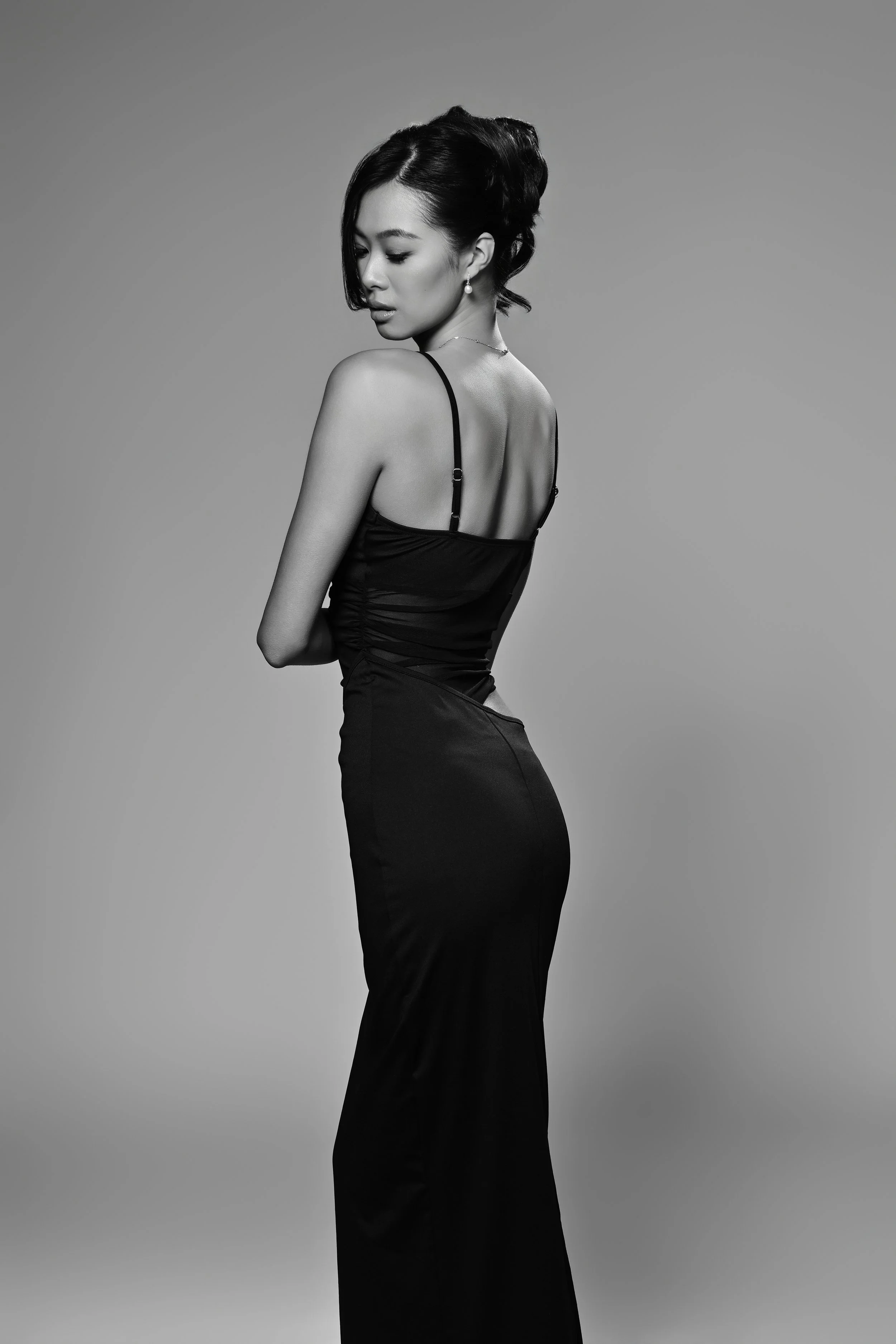 Portrait of a women in a elegant dress with a up hairdo