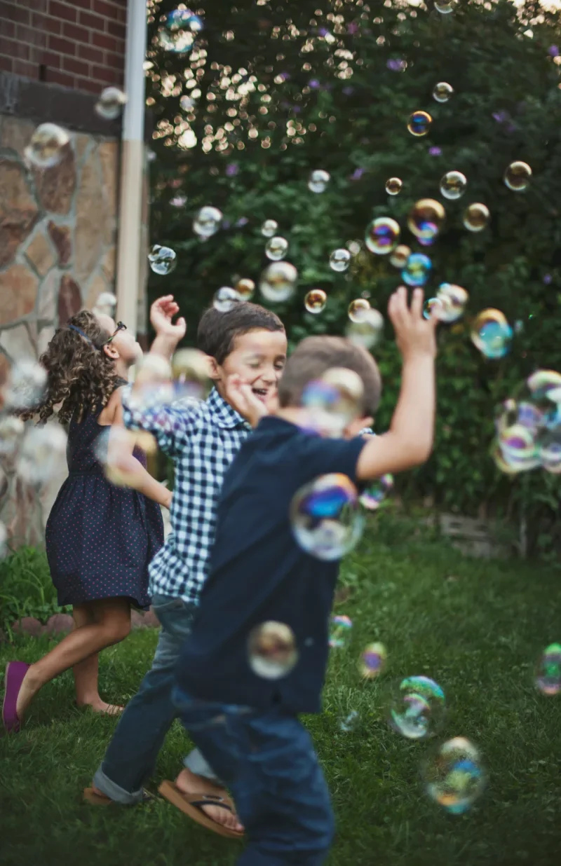 Children playing with bubbles.