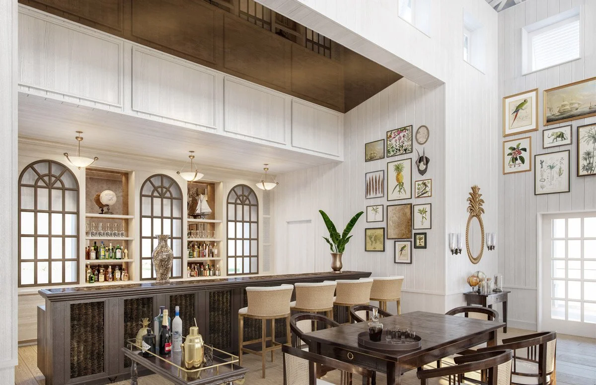 A bright and airy home bar area with white paneled walls, large arched windows, and artwork on the walls. There is a dark wood bar counter with a vase and a row of beige barstools. In front, there is a dark wood dining table with matching chairs, a bar cart with bottles, and a small table with decor items. Natural light fills the space.