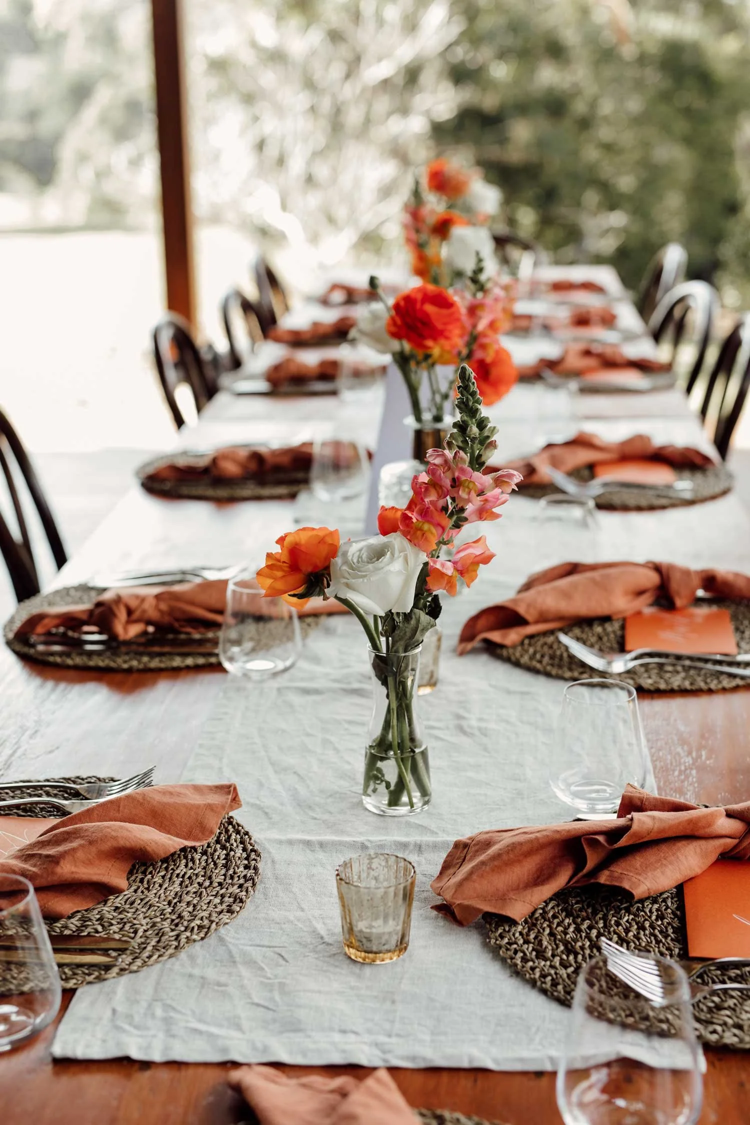 A long wedding table dressed with flowers at Mason Winery