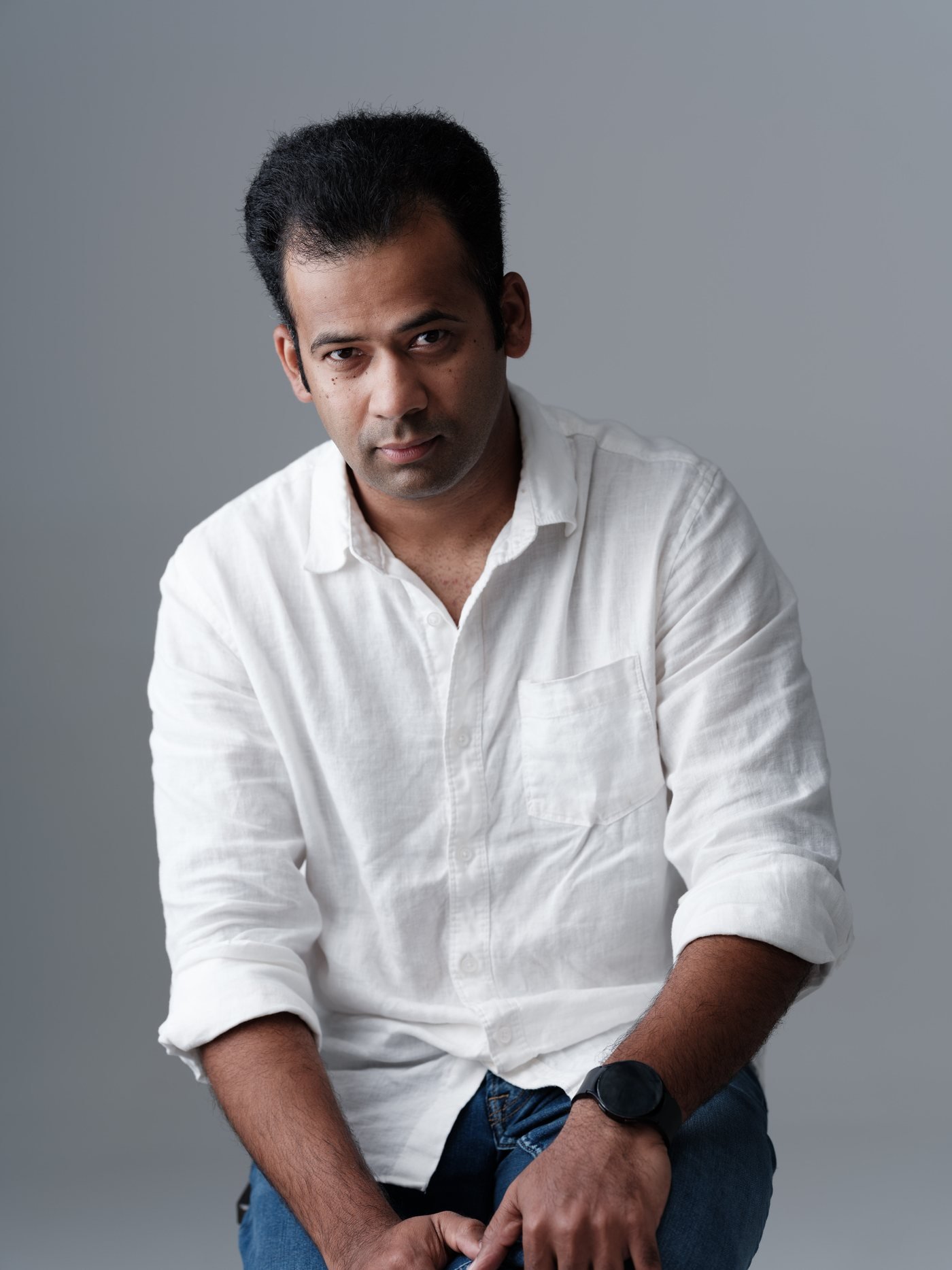 minimax-headshot-white-shirt-seated.jpg
