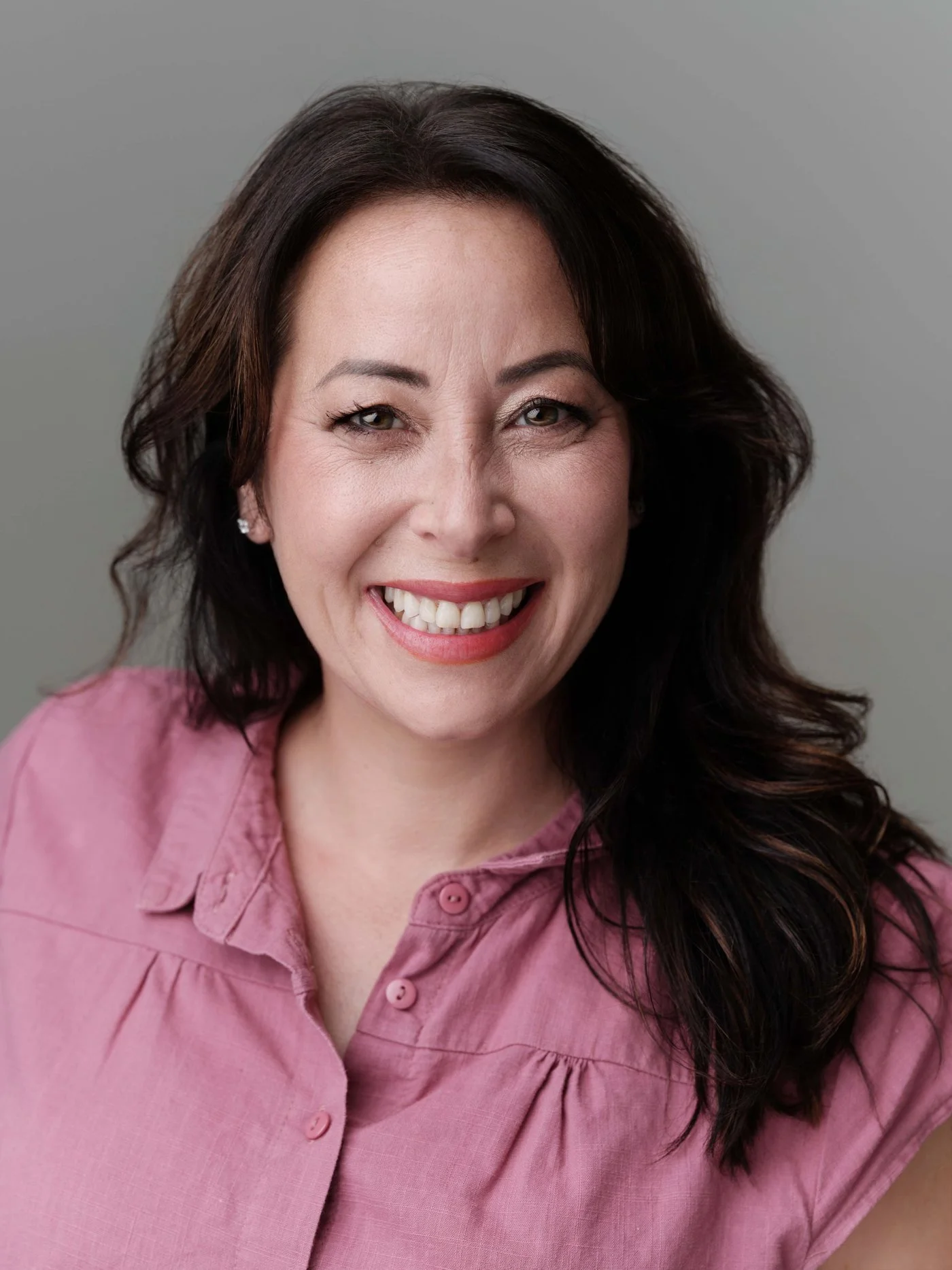 minimax-headshot-pink-shirt-smiling.jpg