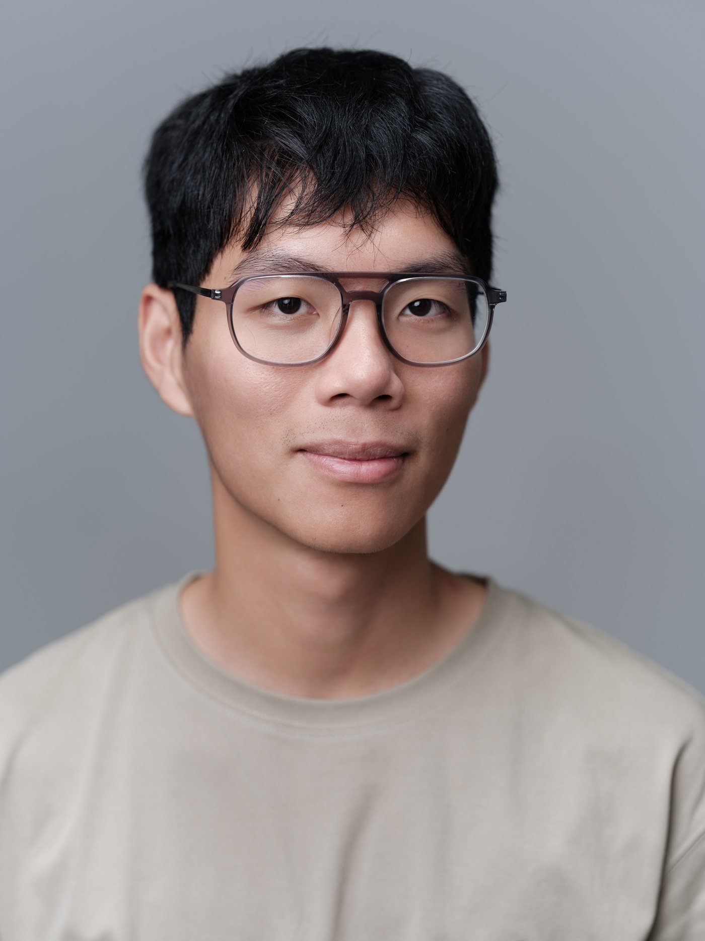minimax-headshot-glasses-tan-tee.jpg