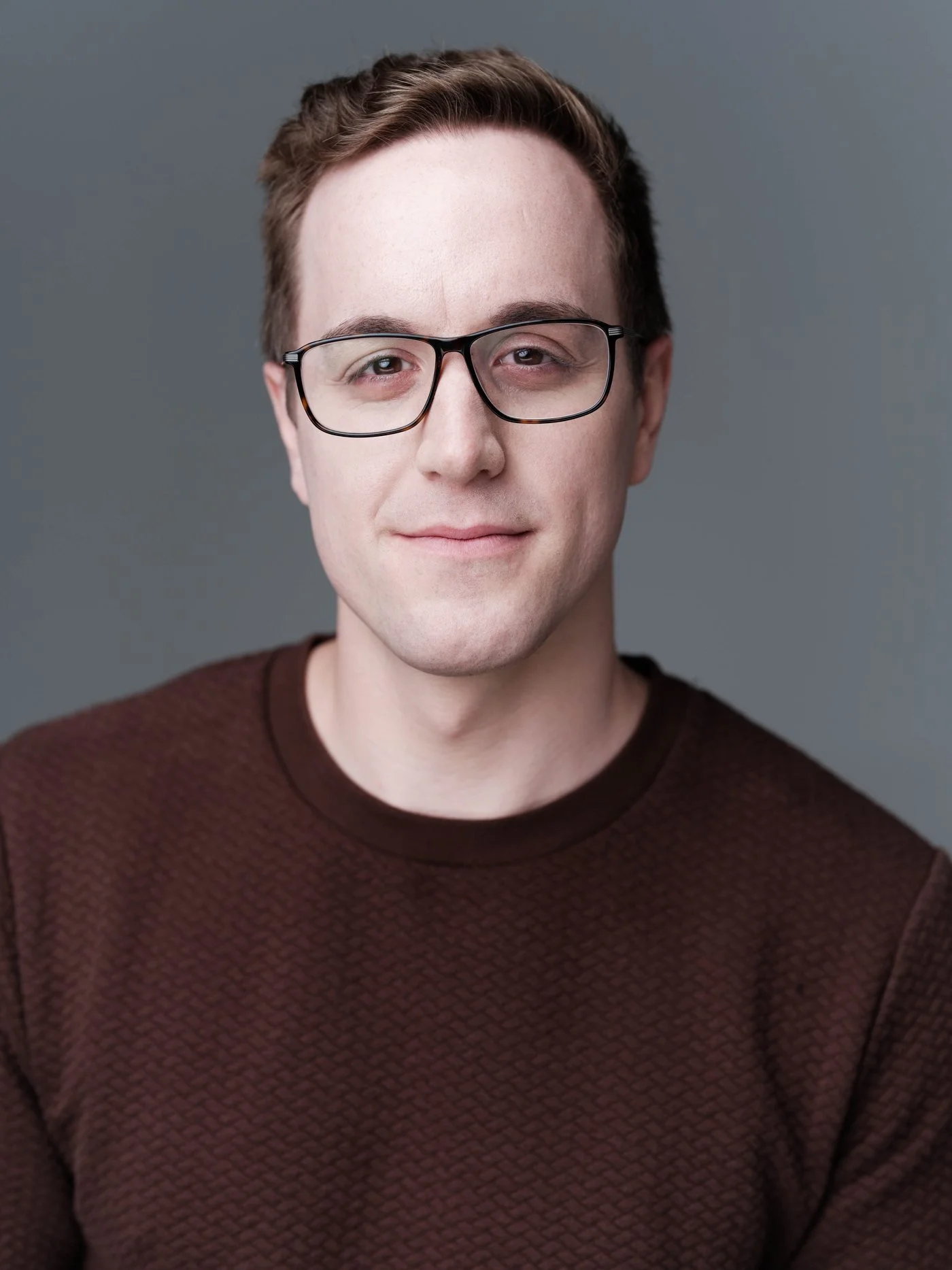 minimax-headshot-glasses-burgundy.jpg