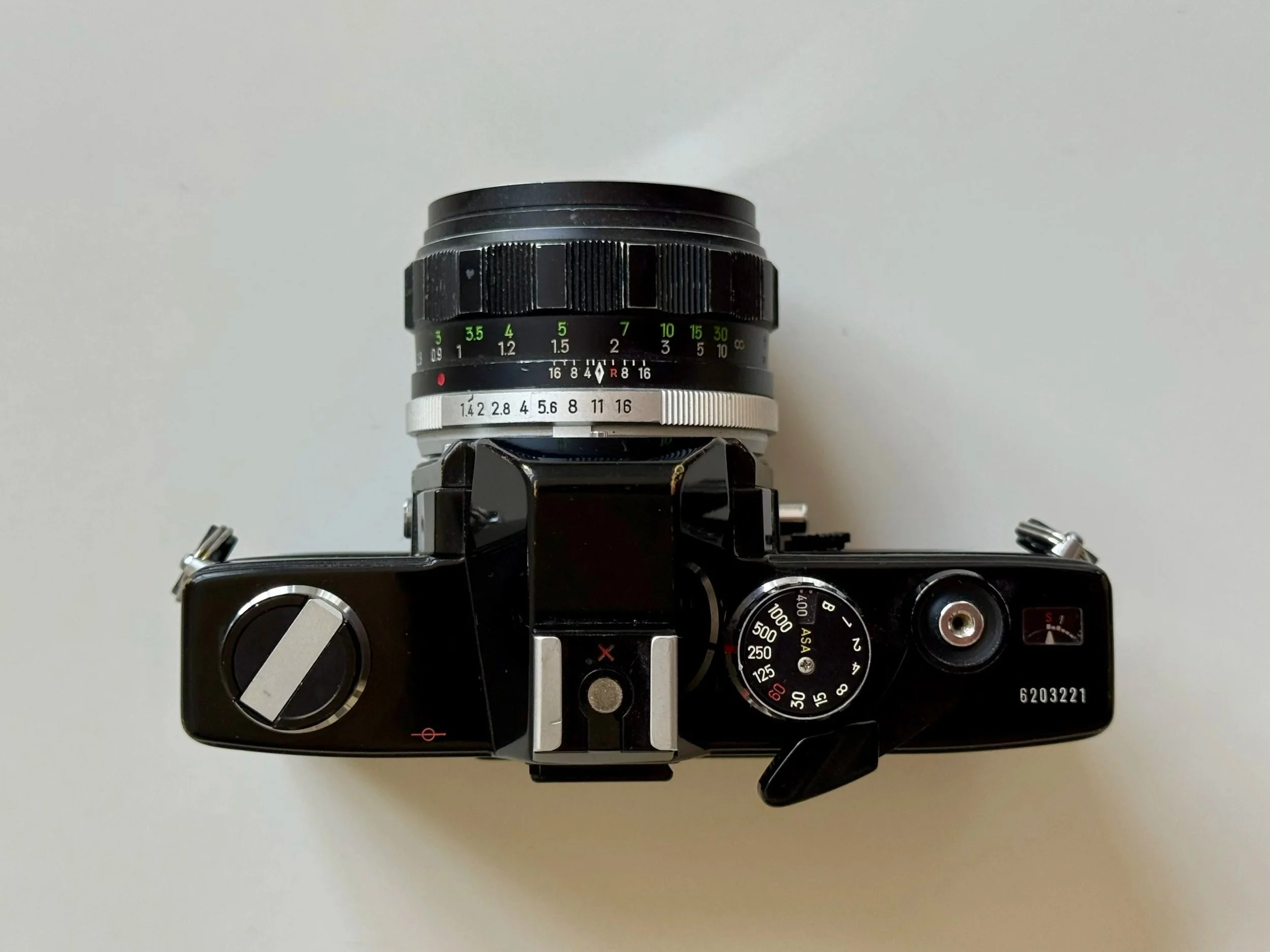 Minolta SR-101 top down view with film rewind, shutter speed dial, film advance lever and frame counter.