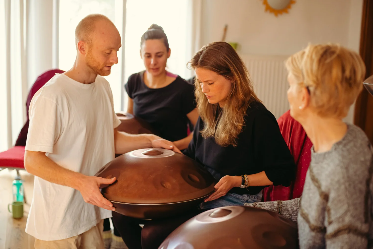 Workshop moment: people discovering the handpan together
