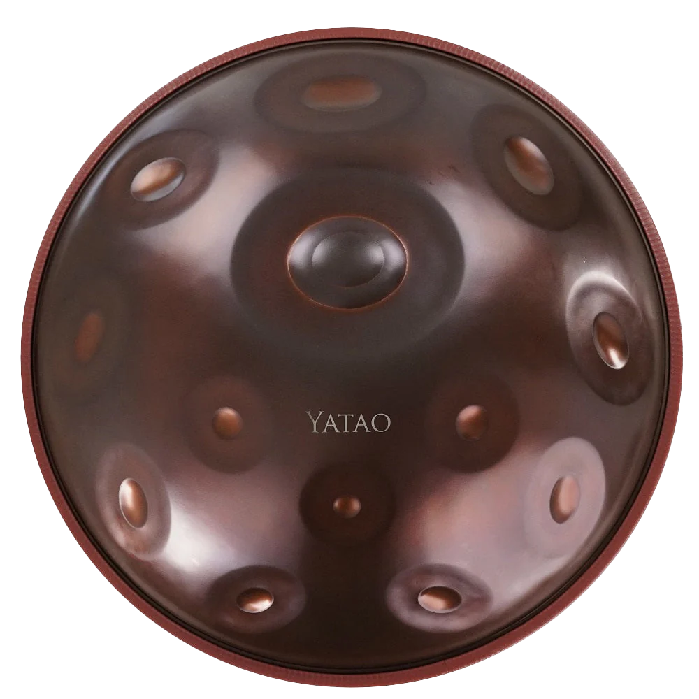 Close-up of a circular handpan musical instrument with the brand name YATAO in the center.
