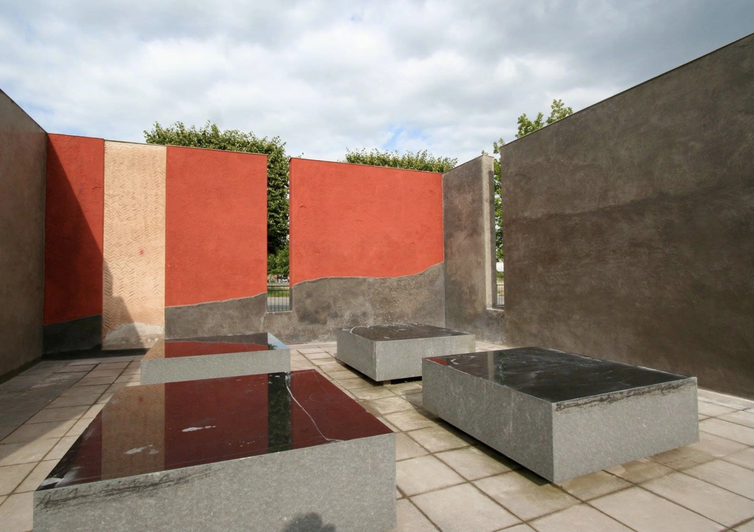 rammed earth walls with colour plaster
