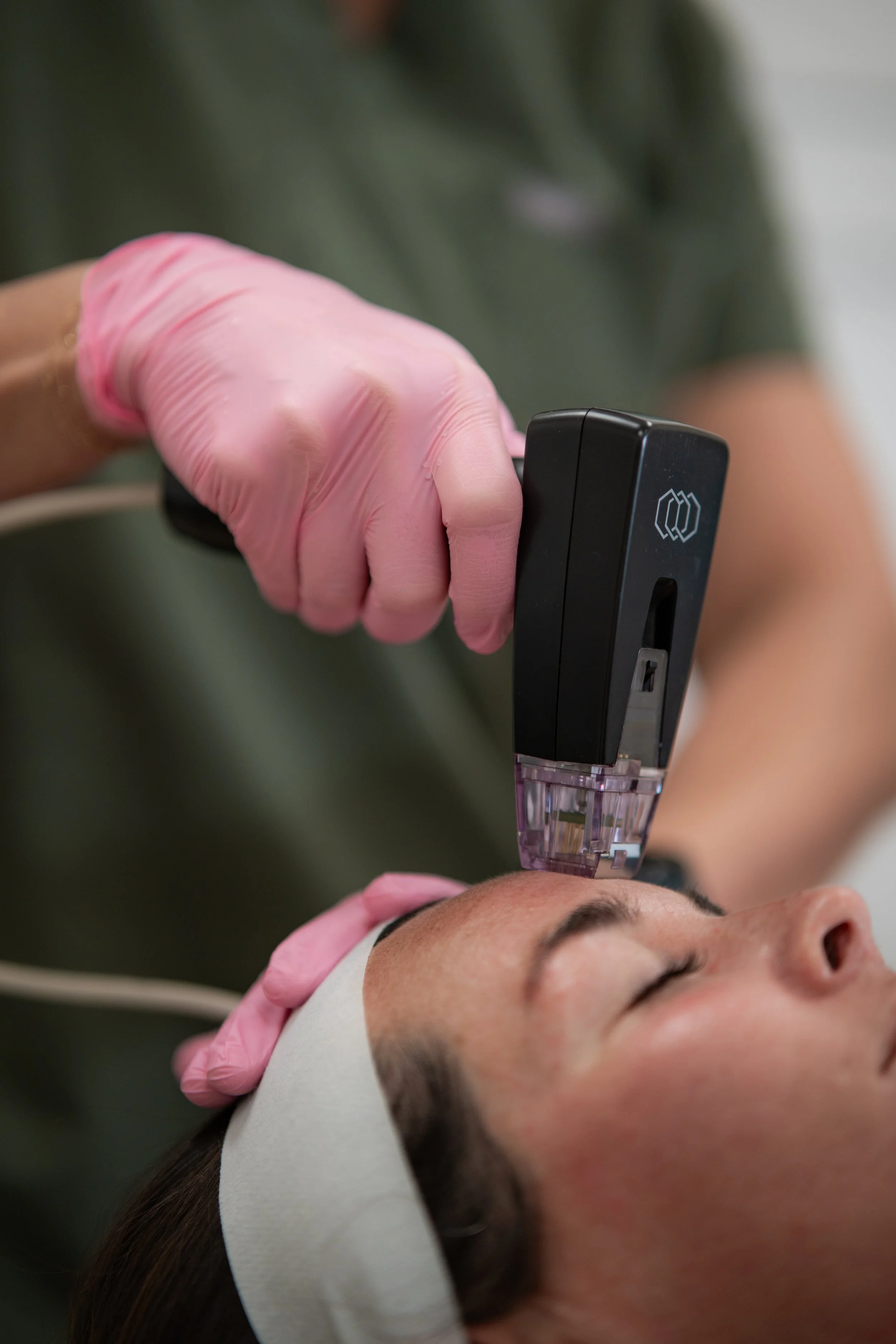 Licensed provider administering Morpheus8 RF Microneedling on face for anti-aging and skin rejuvenation to improve texture, tone, and firmness.
