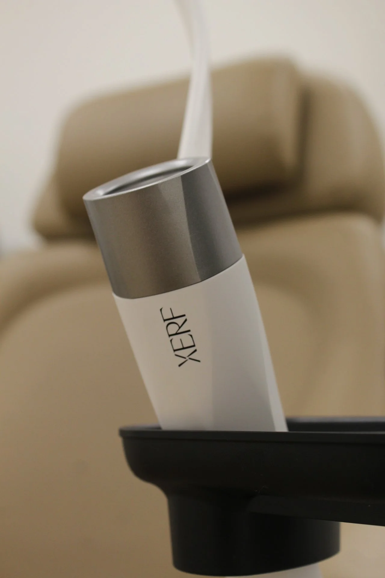 XERF radiofrequency handpiece used during a skin tightening treatment at Luminess Med Spa