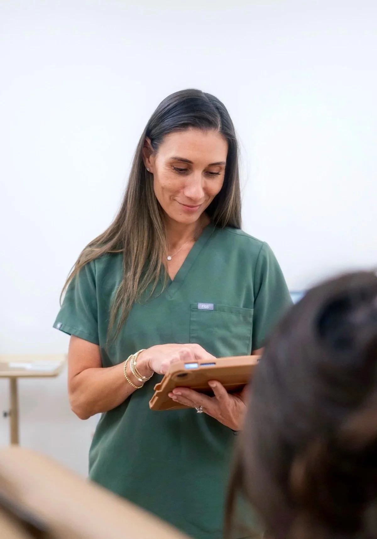 Licensed provider reviewing personalized wellness plan for peptide therapy, hormone support, and weight loss