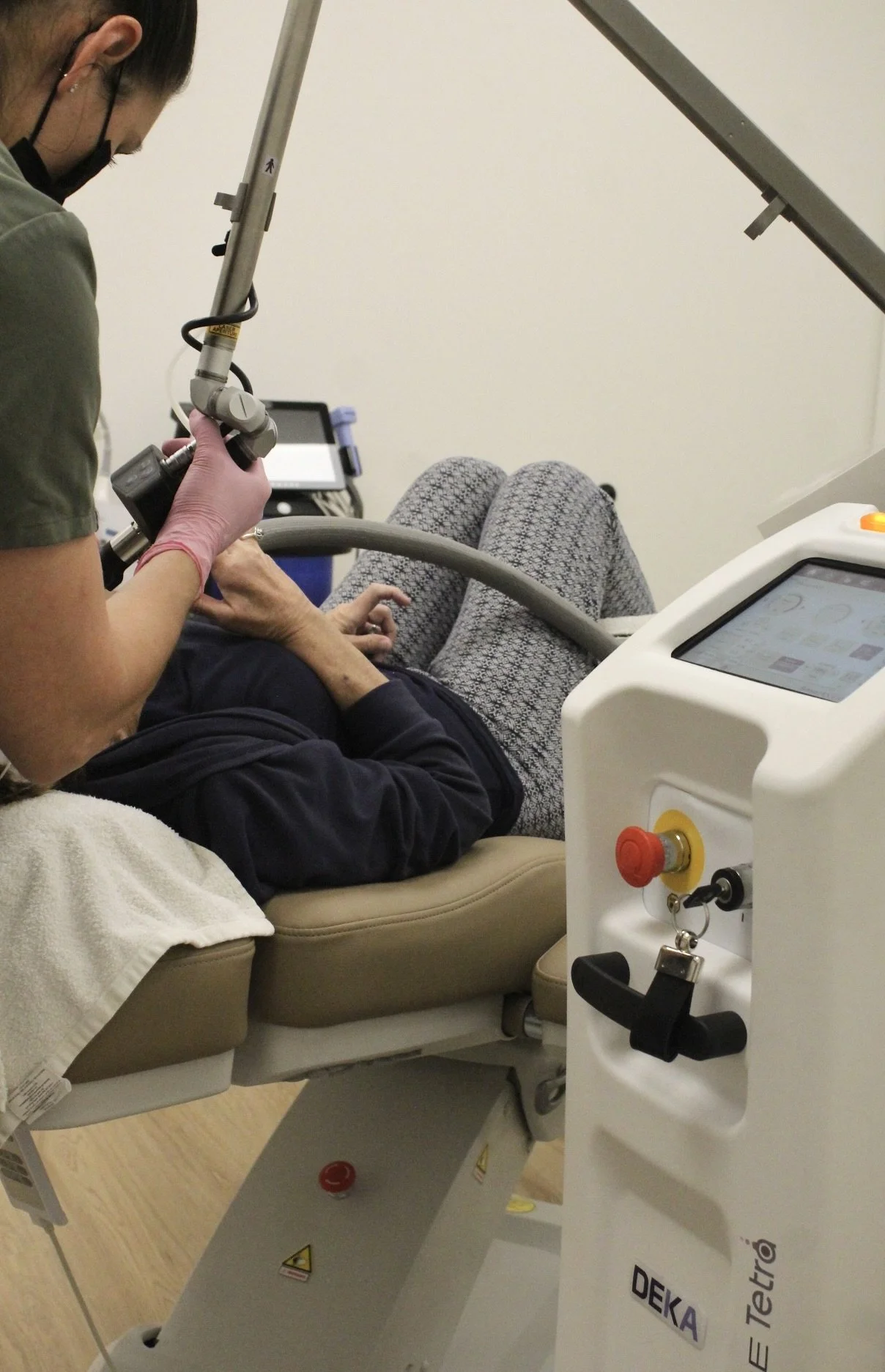 Aesthetic provider administering CO2 laser treatment for advanced skin renewal and anti-aging