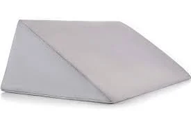 A white, folded paper napkin on a flat surface.