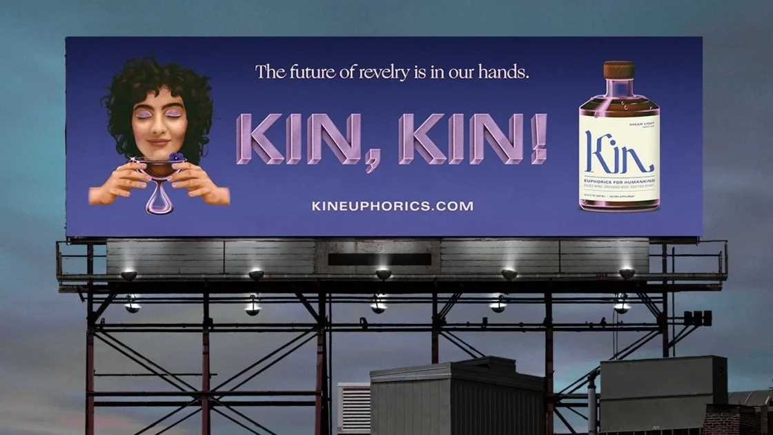 Billboard advertisement for Kineuphorizs featuring a woman with curly hair holding a purple liquid drop and a purple bottle labeled 'Kin', with the tagline "The future of revelry is in our hands" and the website 'kineuphorizs.com'