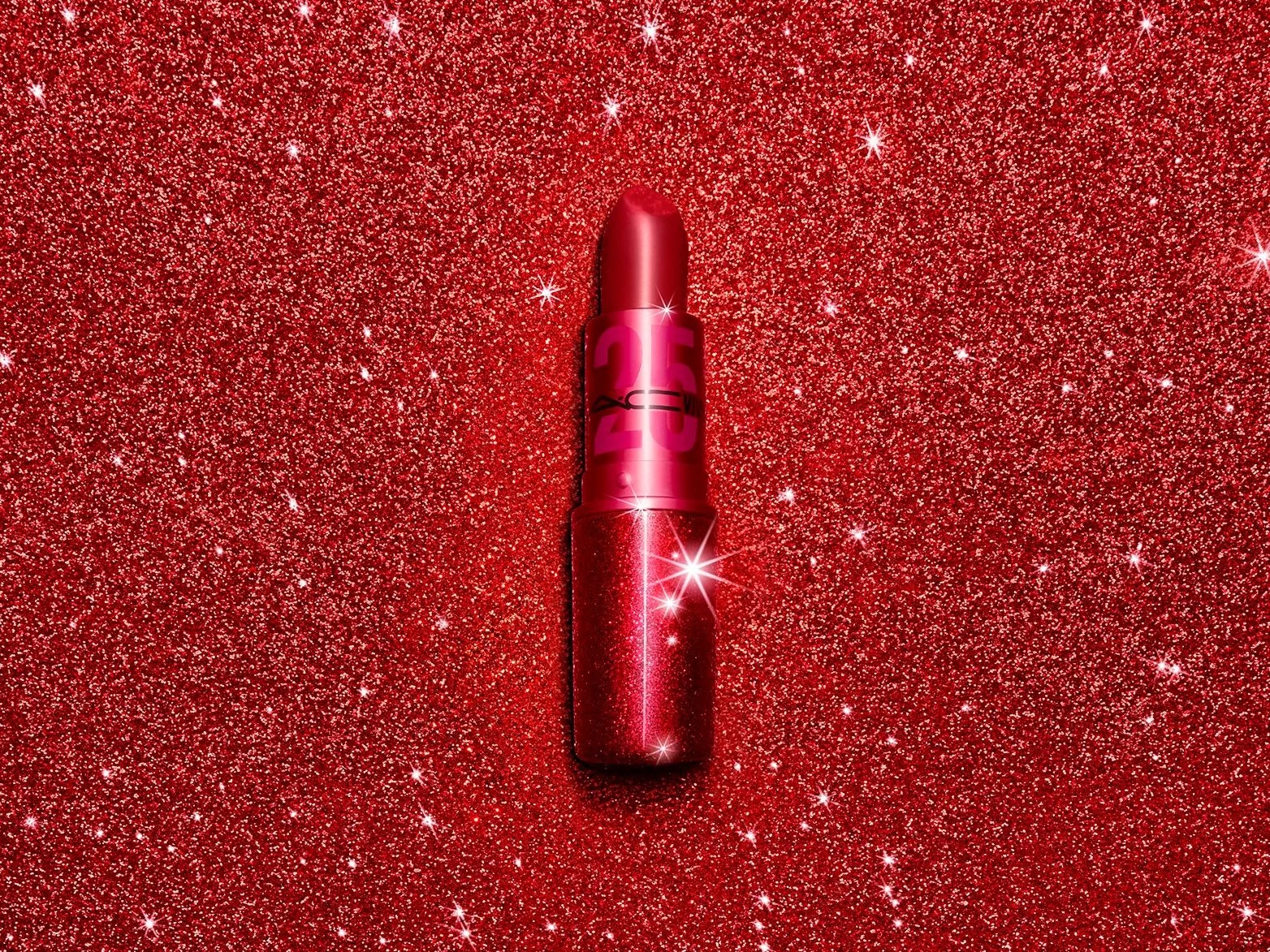 Red lipstick on a vibrant, glittery red background