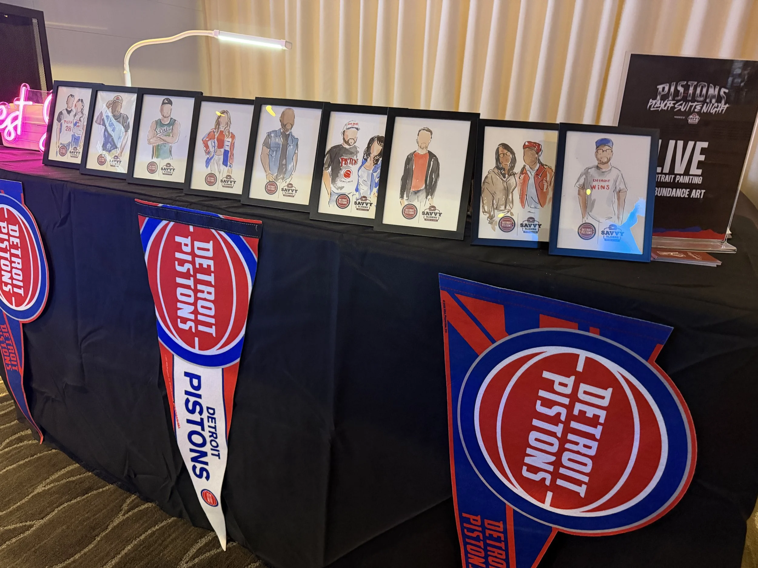 Hand drawn corporate events portraits featuring Detroit influencers at a Pistons event.