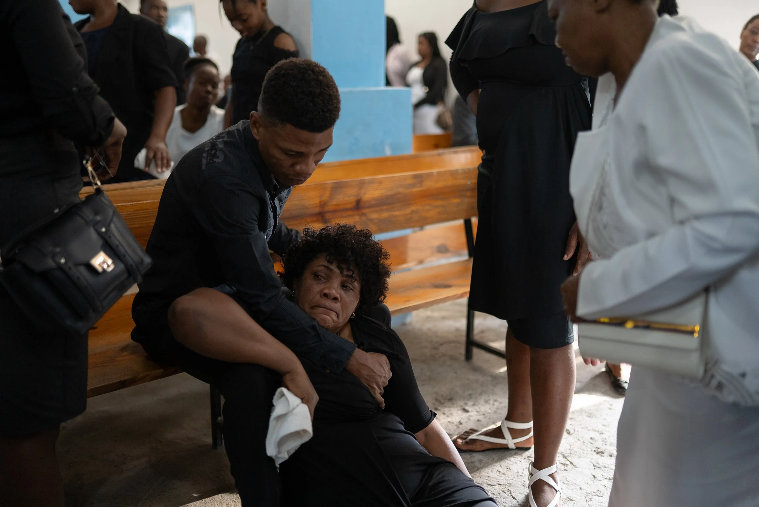 The funeral of Johnny Alexis, 33, who dropping off a client on a run as a motorcycle taxi driver and was killed in the crossfire between gangs and police in downtown Port-au-Prince on Nov. 11, 2022.
