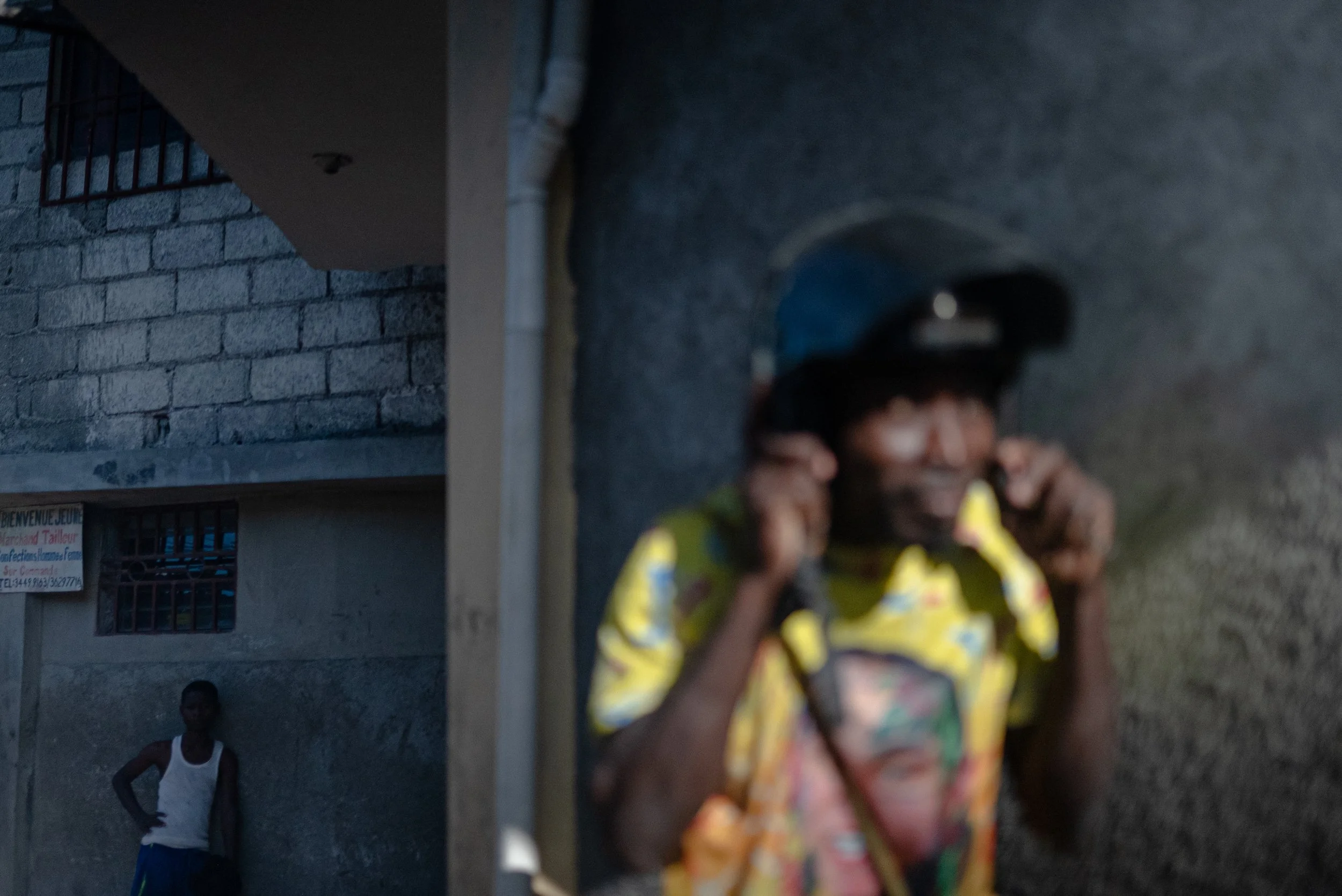 Mucsone, a motorycle taxi driver, puts on his helmet afte leaving the family of his friend, Johnny Alexis, 33, who was killed by a shootout with armed groups in Port-au-Prince.