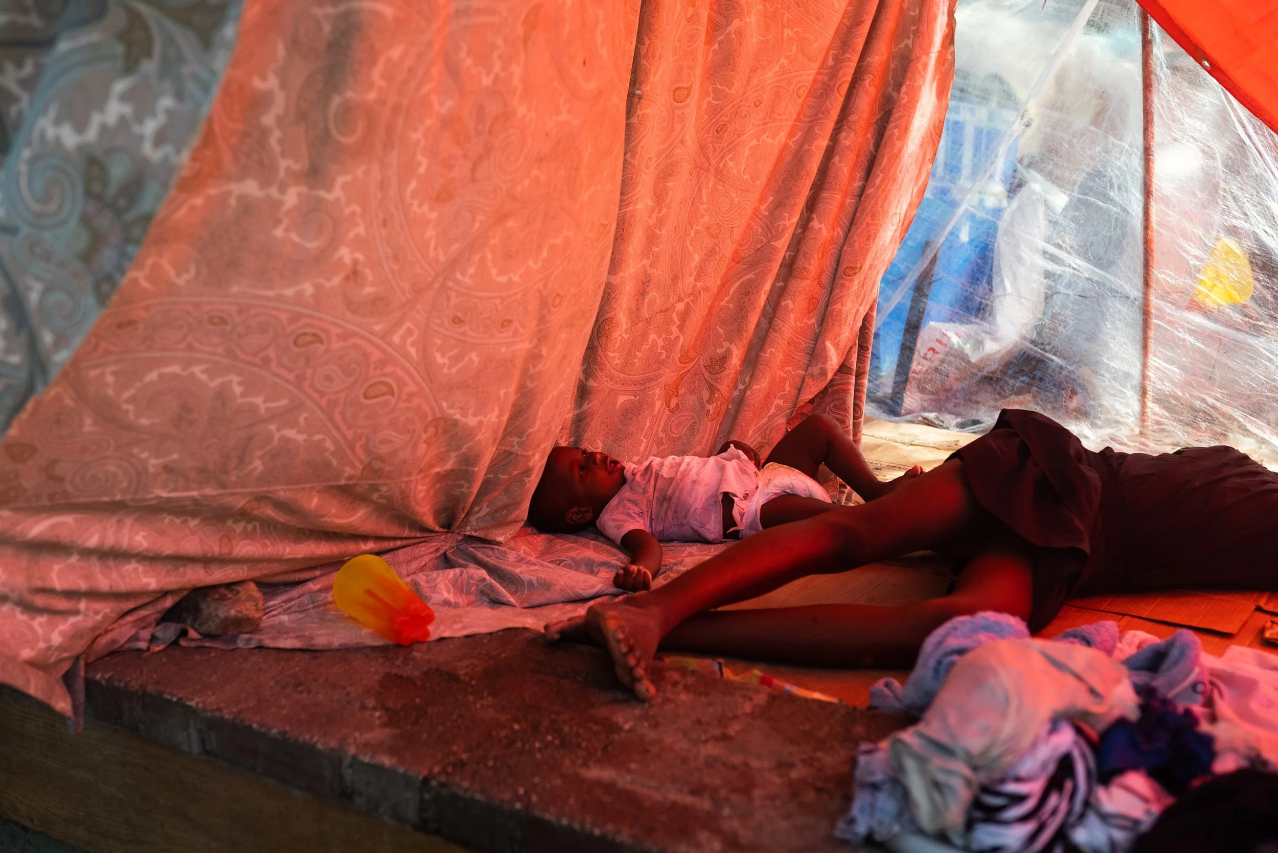 A baby at the Hugo Chavez makeshift displacement camp in front of the airport in Port-au-Prince.