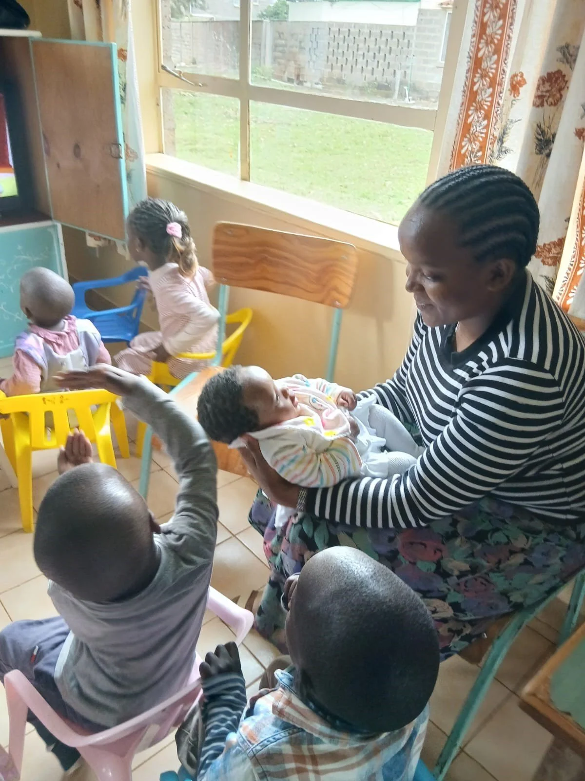 Asrat and the babies.jpg