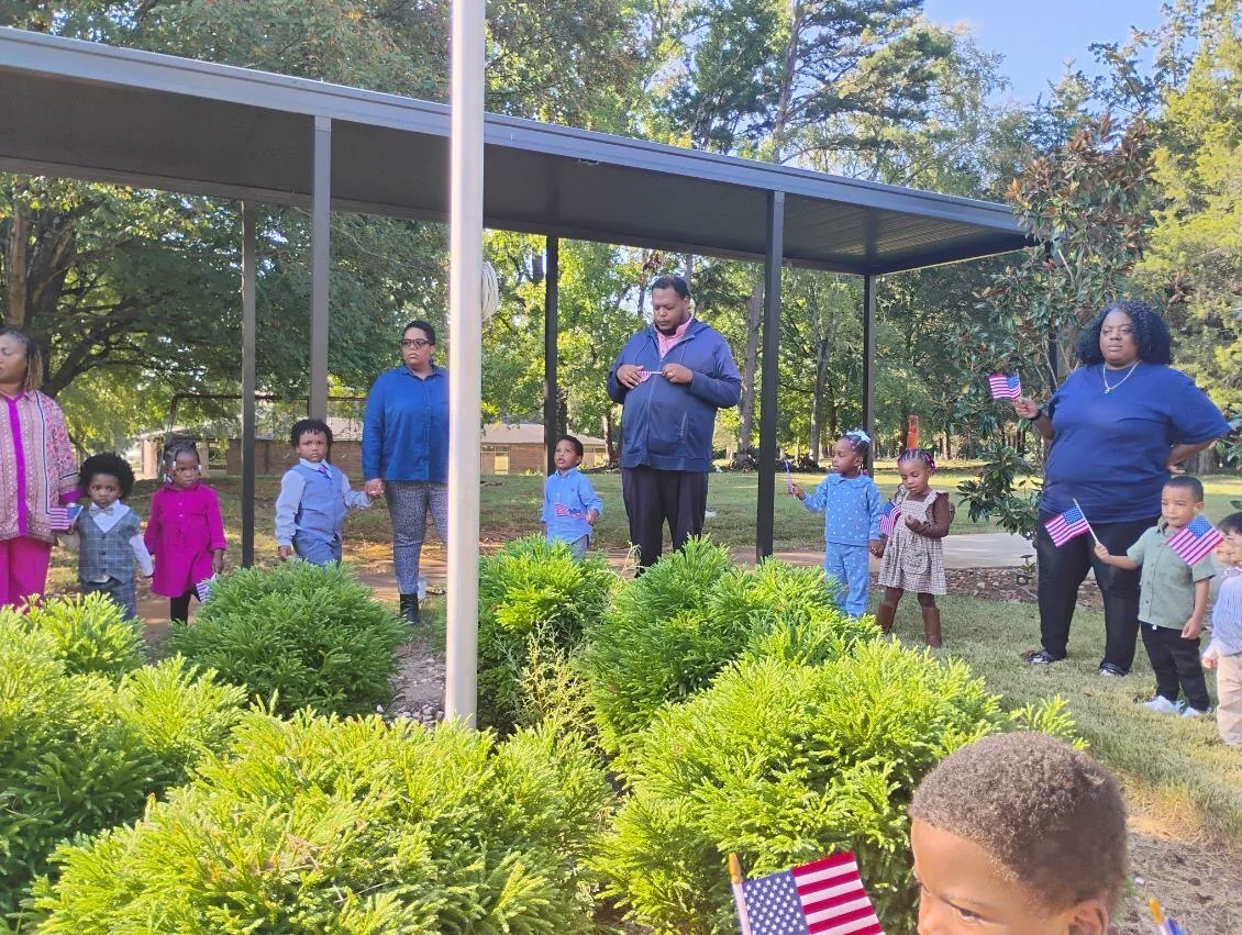   VCCP staff, students, and parents gather around the American Flag to pray!  