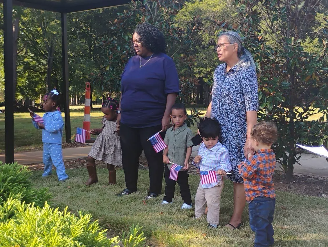   VCCP staff, students, and parents gather around the American Flag to pray!  