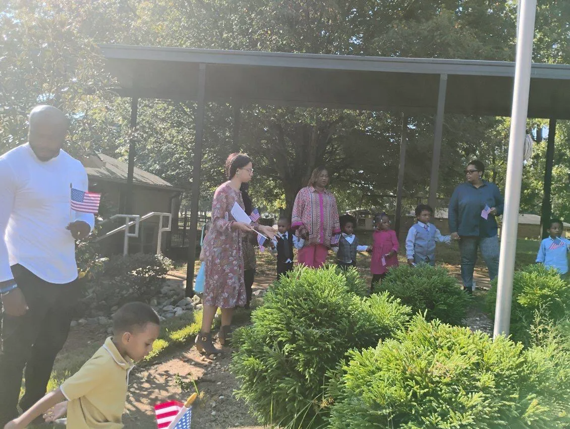   VCCP staff, students, and parents gather around the American Flag to pray!  